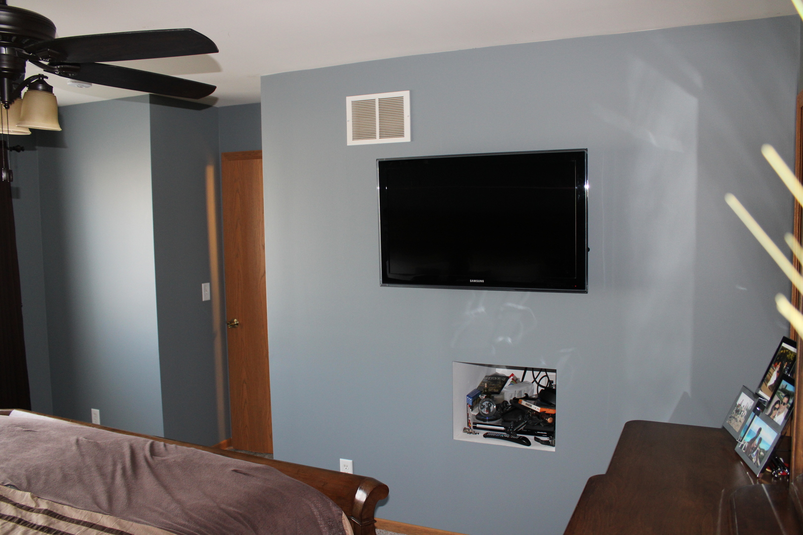 245 Rollin Road, Unit D Somonauk, IL 60552 - Photo 21 of 29 a bedroom with a bed and a flat screen tv