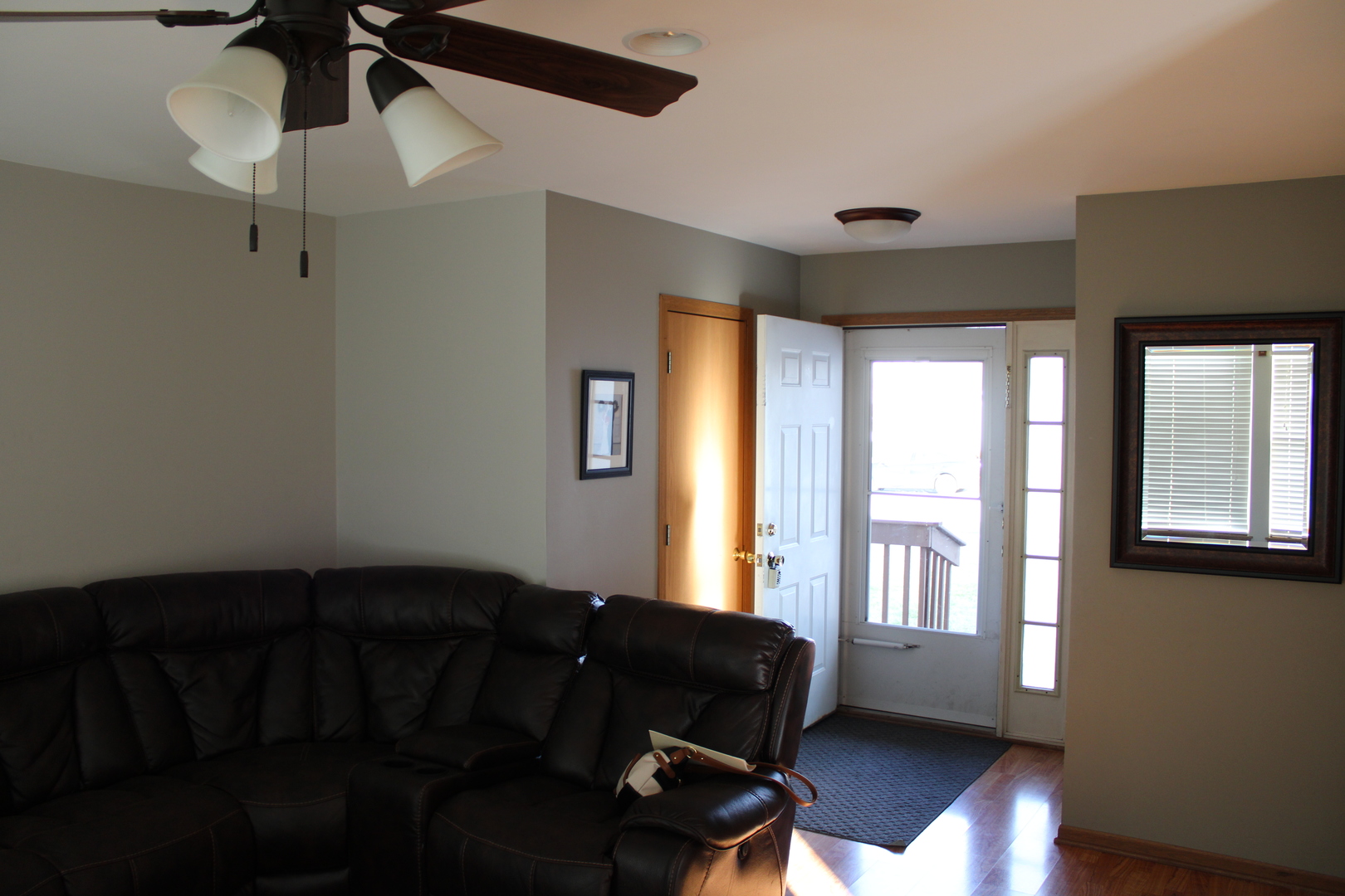 245 Rollin Road, Unit D Somonauk, IL 60552 - Photo 4 of 29 a living room with furniture and a window