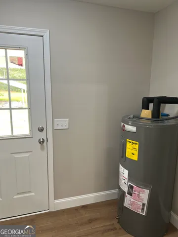 a view of an entryway with wooden floor