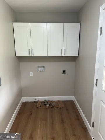 a view of room with wooden floor