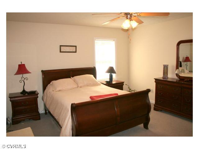 1168 Epworth Road Aylett, VA 23009 - Photo 12 of 21 Master Bedroom - The master bedroom has plenty of space, a large closet, ceiling fan, lots of natural light, and a private bath.