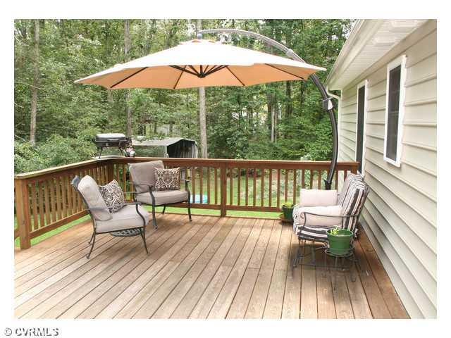 1168 Epworth Road Aylett, VA 23009 - Photo 19 of 21 Patio/Deck - The home features a custom built deck, which provides a great space for entertaining.