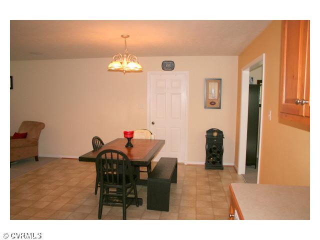 Dining Room - This large eat-in area just off the kitchen is a great spot for entertaining or just enjoying dinner with the family.