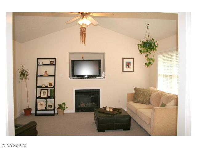 1168 Epworth Road Aylett, VA 23009 - Photo 9 of 21 Den/Family/Great Room - Not many homes this size have both a living room & family room! As you can see this room has tons of natural light, vaulted ceilings, ceiling fan, gas fireplace, & access to the deck.