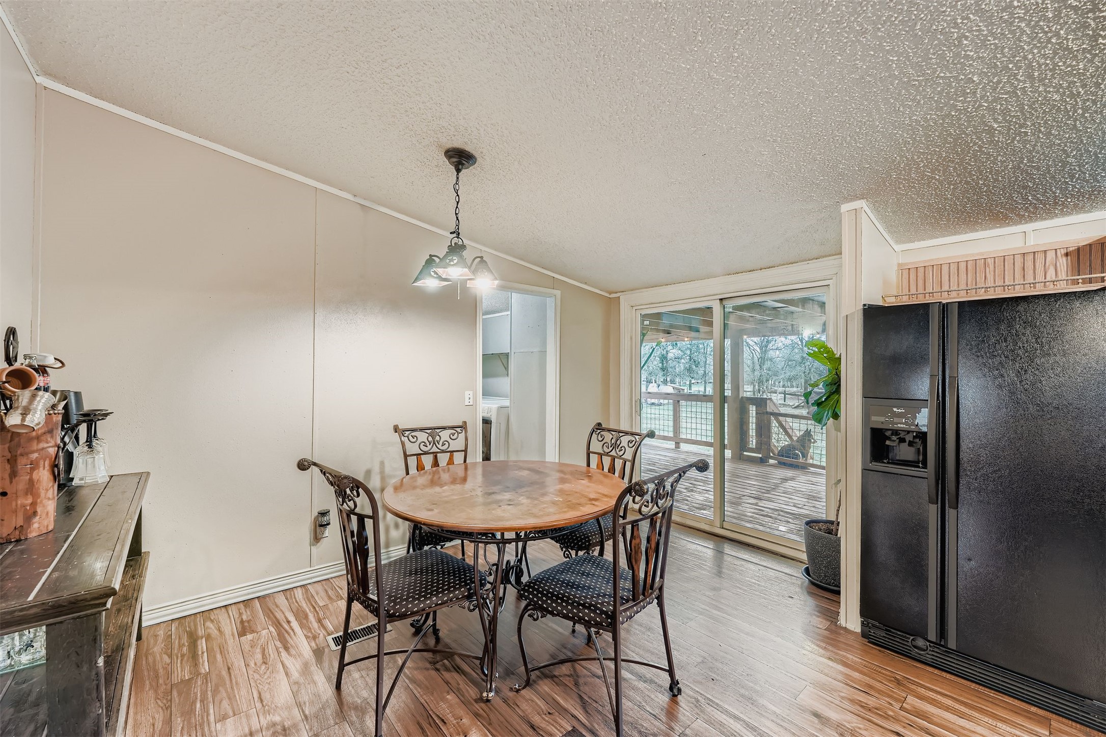 145 Alyssa Loop Bastrop, TX 78602 - Photo 12 of 40 a view of a dining room with furniture window and wooden floor