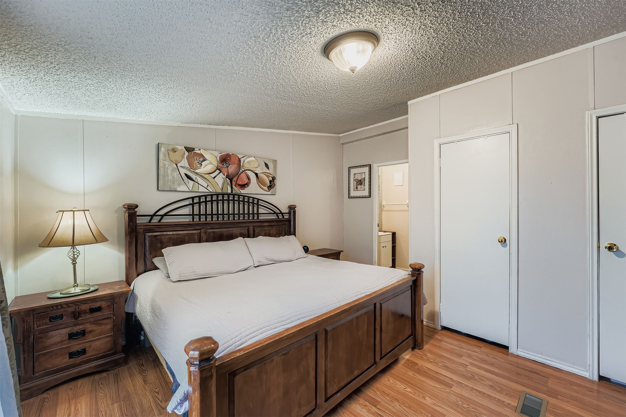 145 Alyssa Loop Bastrop, TX 78602 - Photo 18 of 40 a bedroom with a bed and a night stand