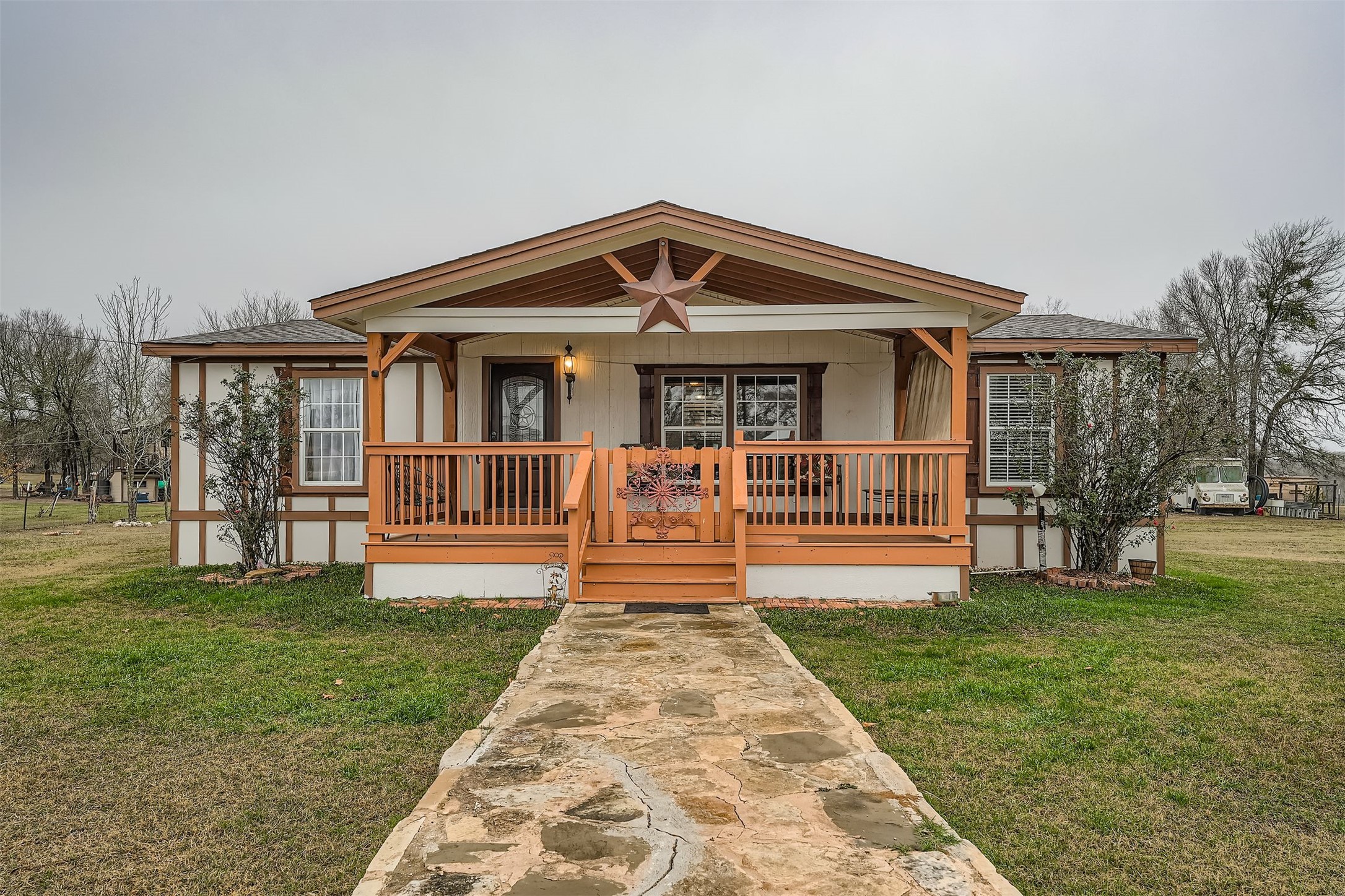 145 Alyssa Loop Bastrop, TX 78602 - Photo 2 of 40 a front view of a house with a yard