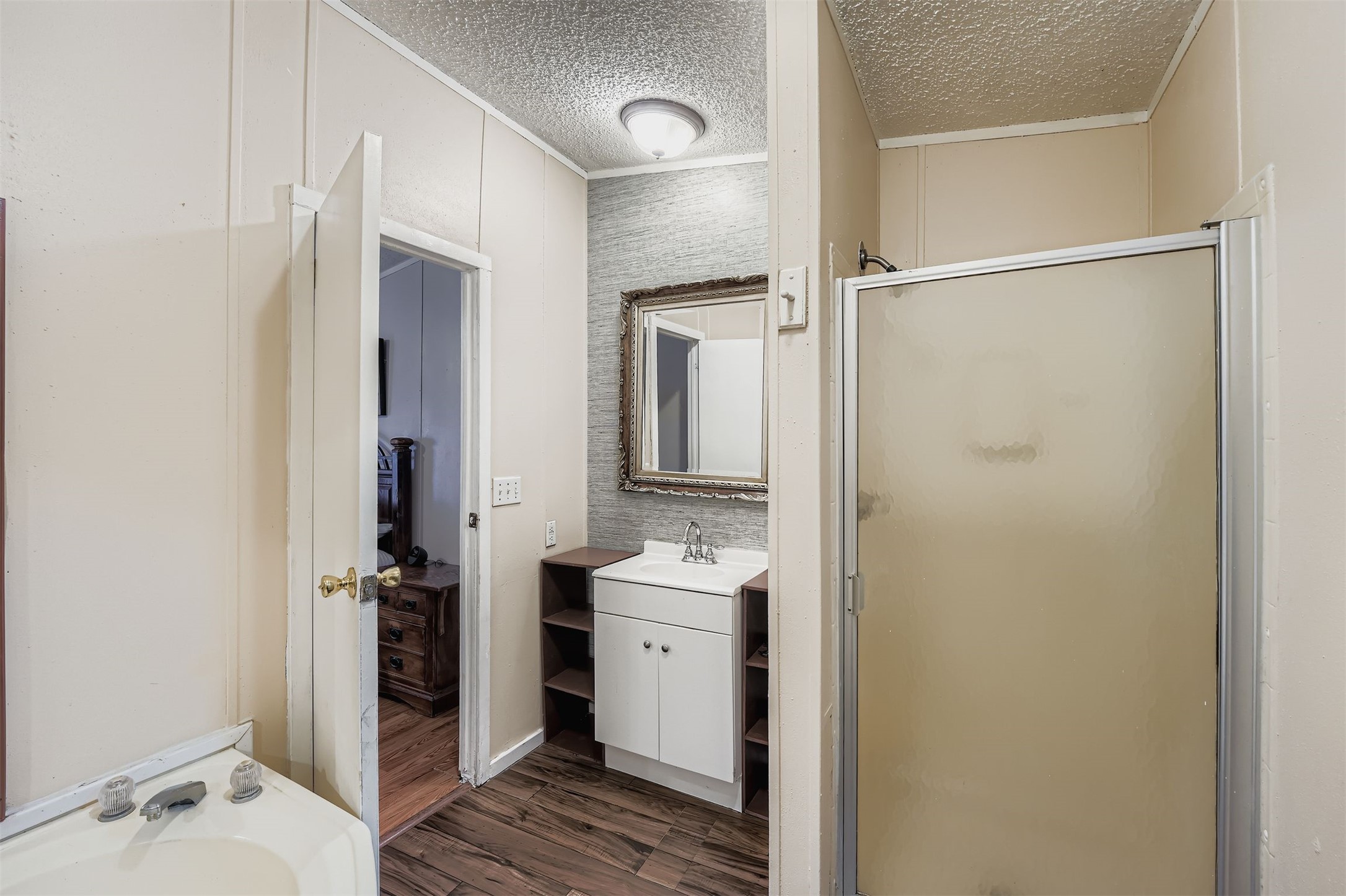 145 Alyssa Loop Bastrop, TX 78602 - Photo 21 of 40 a bathroom with a sink and a mirror