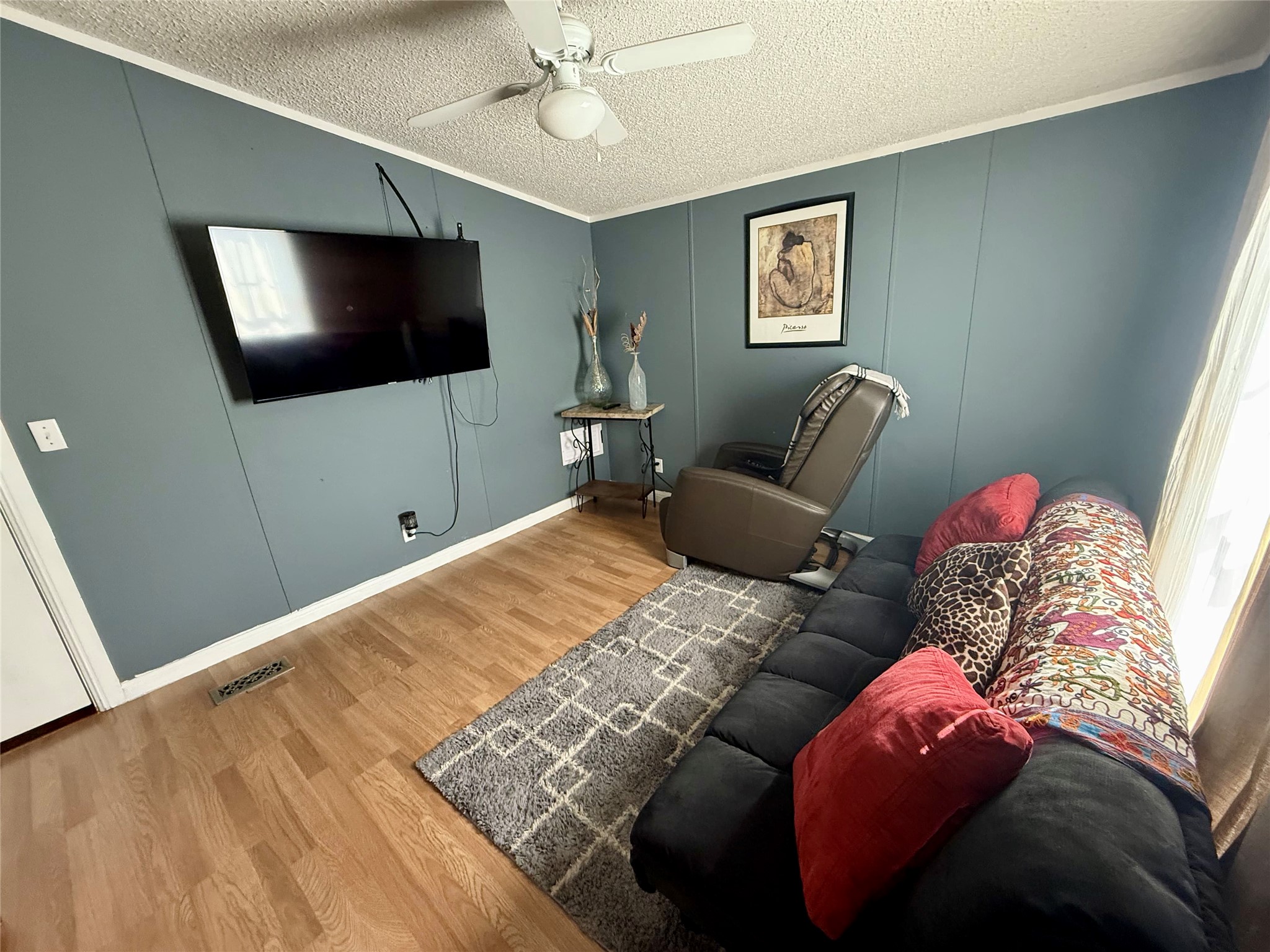 145 Alyssa Loop Bastrop, TX 78602 - Photo 25 of 40 a bedroom with a bed and a flat screen tv