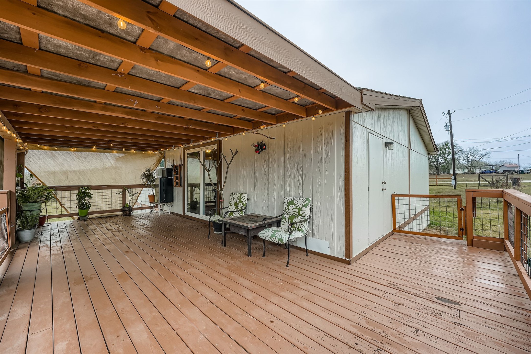 145 Alyssa Loop Bastrop, TX 78602 - Photo 27 of 40 a view of a patio with wooden floor