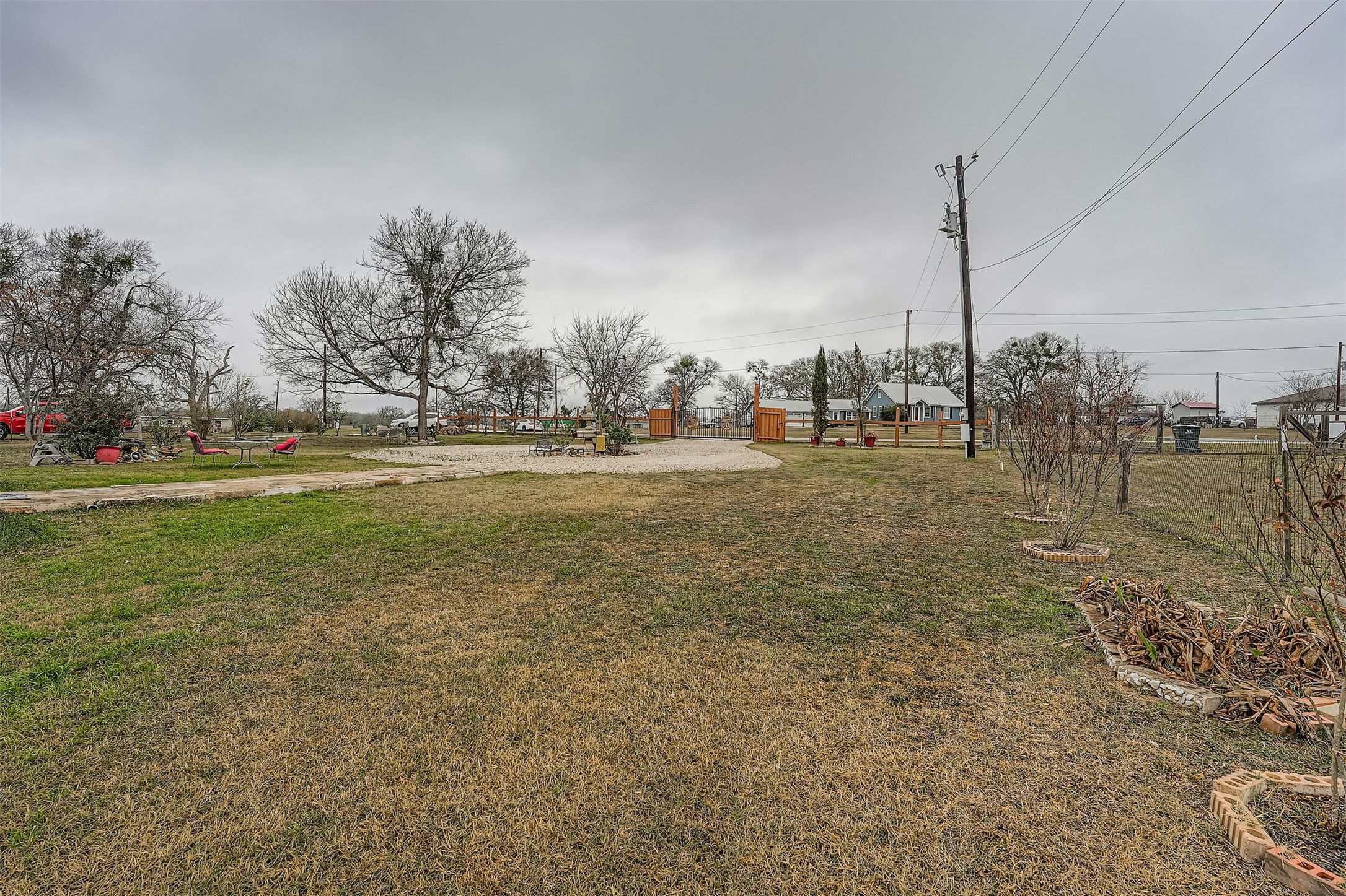 145 Alyssa Loop Bastrop, TX 78602 - Photo 35 of 40 a view of a field with trees in the background