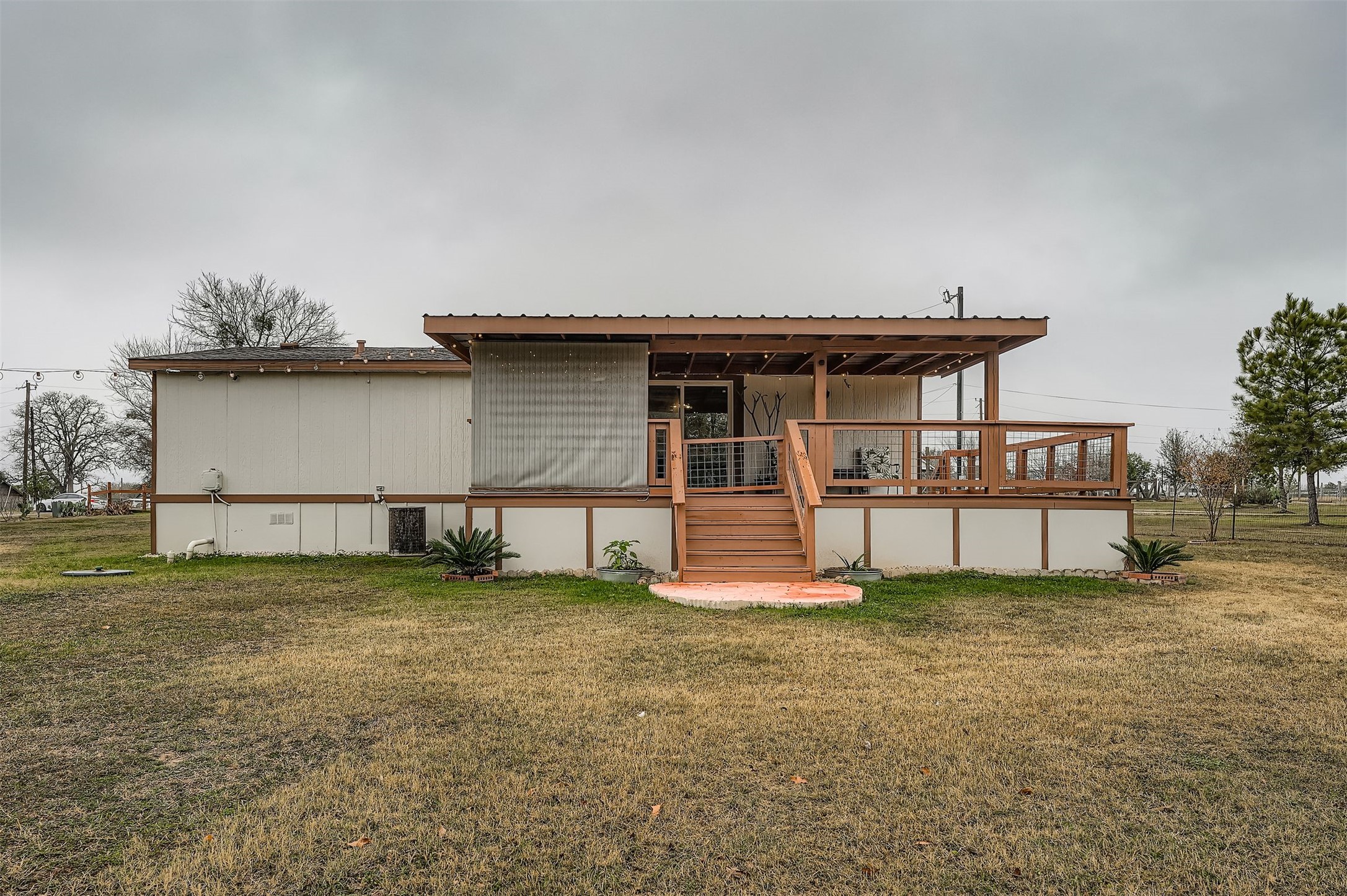 145 Alyssa Loop Bastrop, TX 78602 - Photo 38 of 40 a view of a house with a yard and a bench