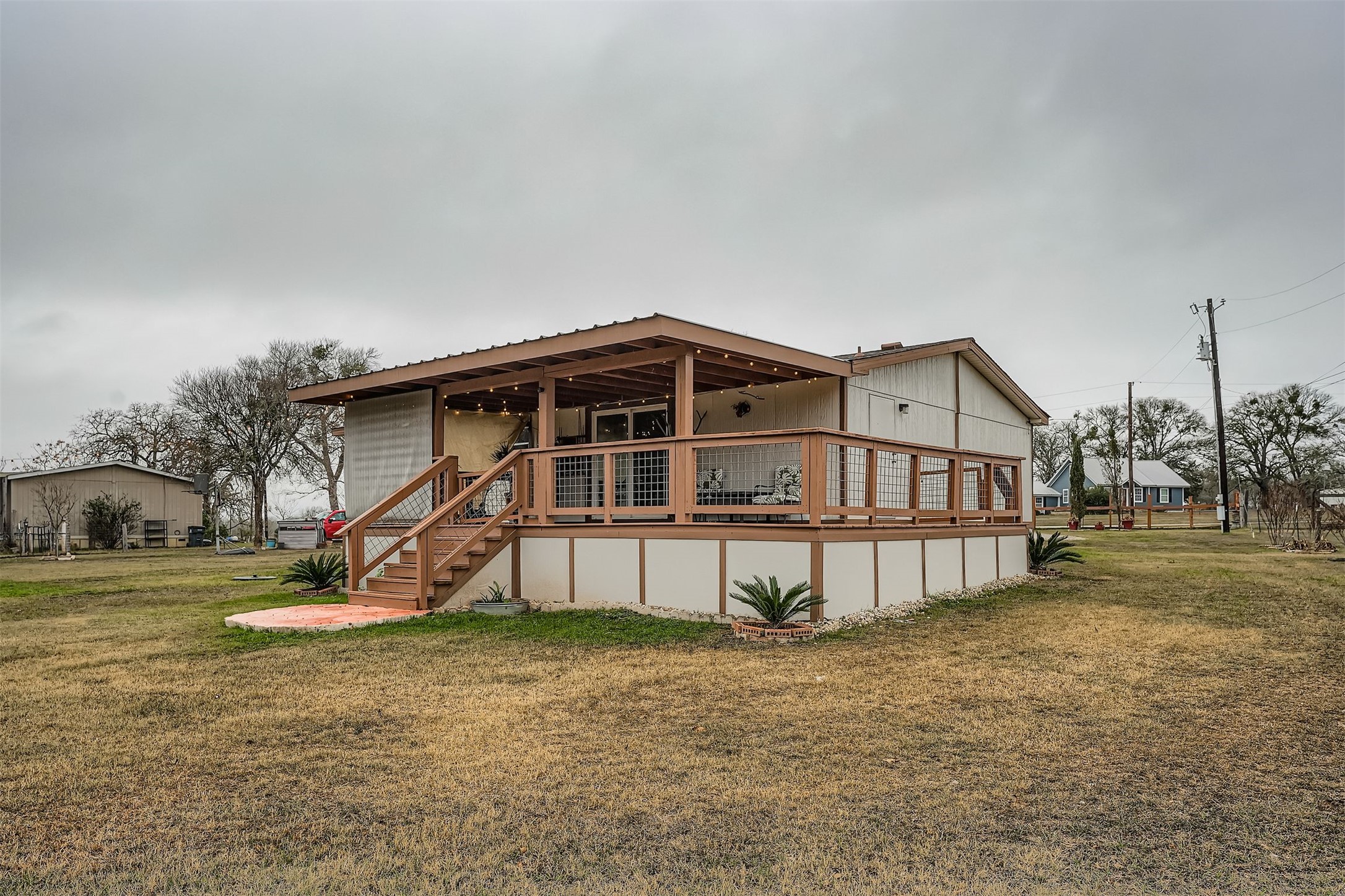 145 Alyssa Loop Bastrop, TX 78602 - Photo 39 of 40 a view of a house with a yard and sitting area