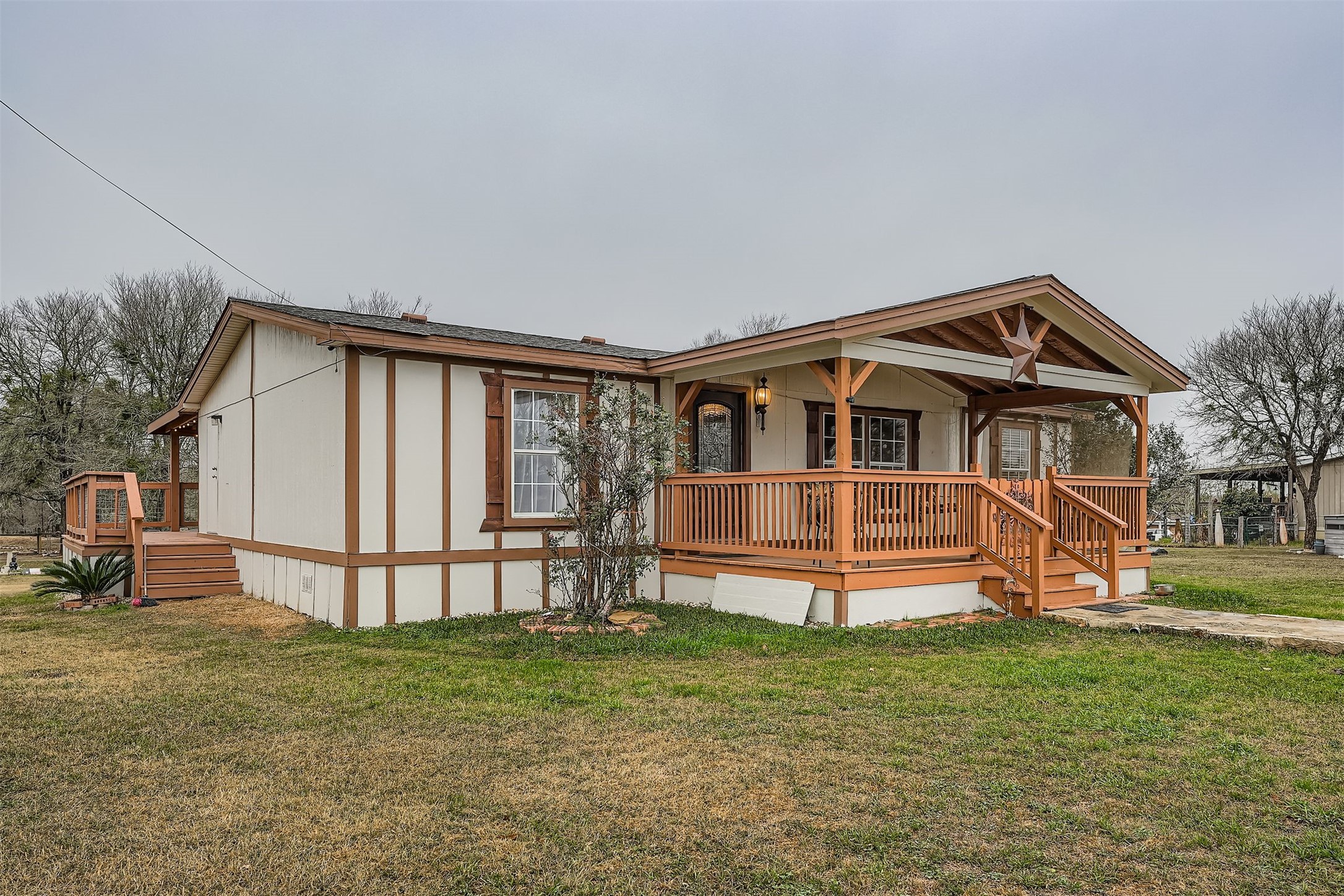 145 Alyssa Loop Bastrop, TX 78602 - Photo 4 of 40 a front view of a house with a yard table and chairs
