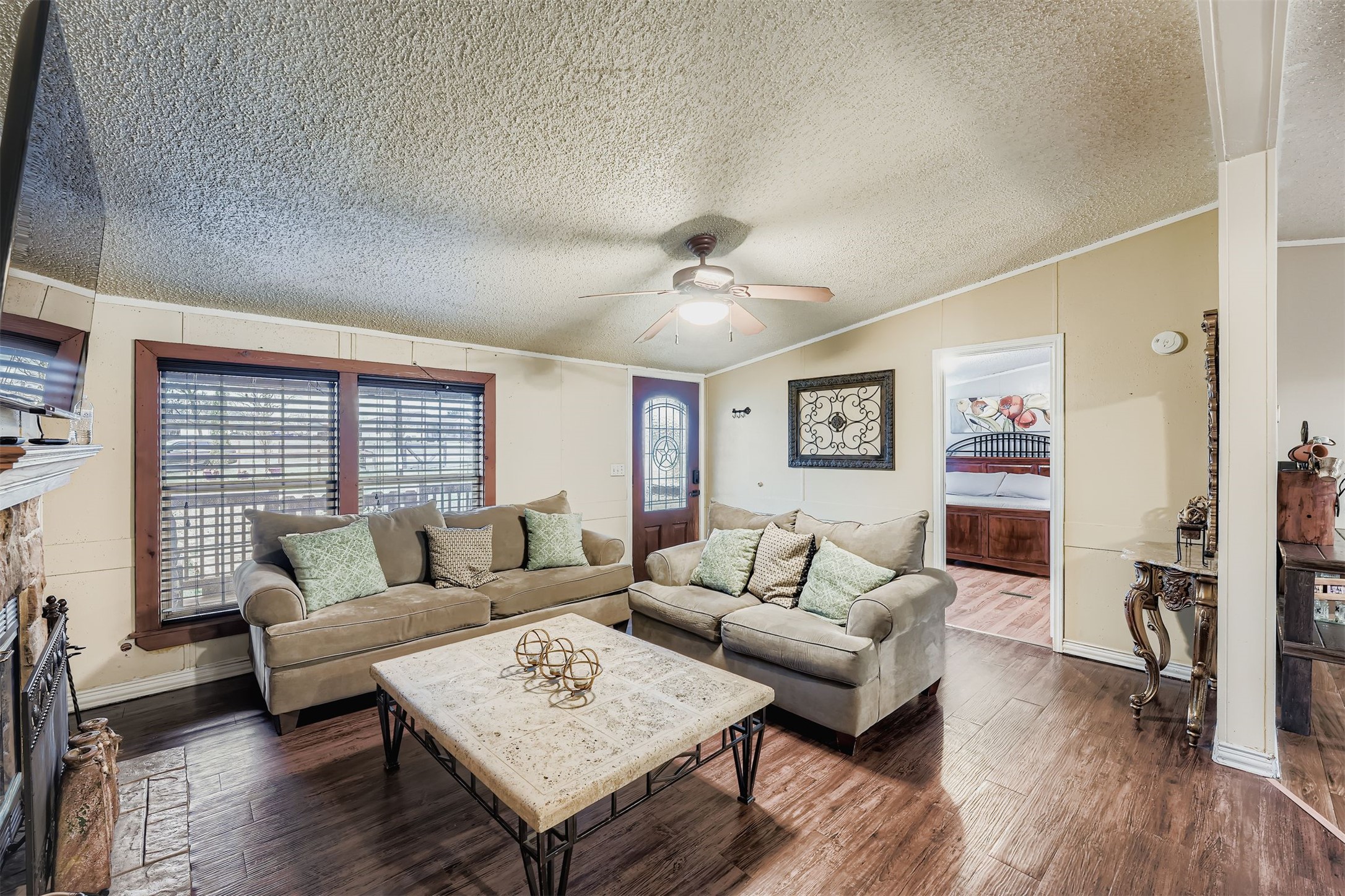 145 Alyssa Loop Bastrop, TX 78602 - Photo 8 of 40 a living room with furniture and wooden floor
