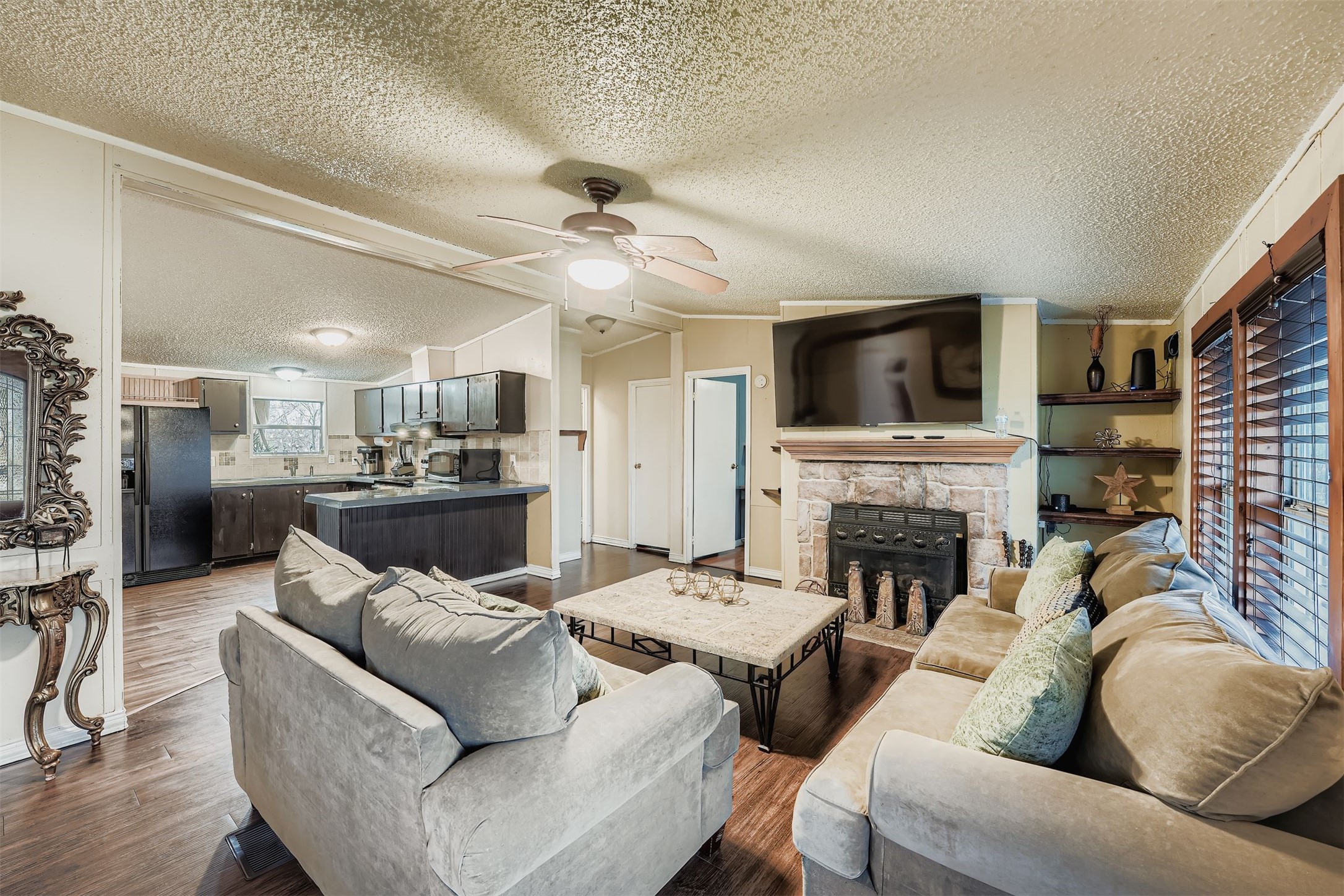 145 Alyssa Loop Bastrop, TX 78602 - Photo 10 of 40 a living room with furniture and a fireplace