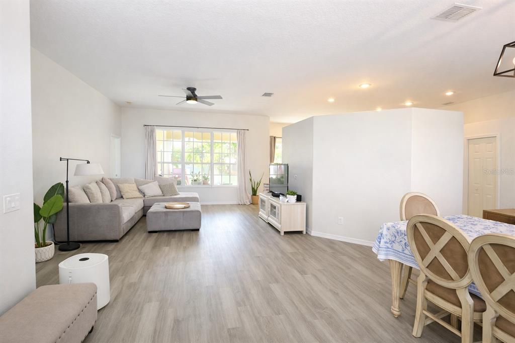 2009 Meadow Rue Court Trinity, FL 34655 - Photo 2 of 21 a living room with furniture and wooden floor