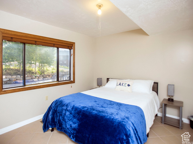 588 Raspberry Patch Road Garden City, UT 84028 - Photo 52 of 74 Bedroom with light tile patterned floors and baseboards
