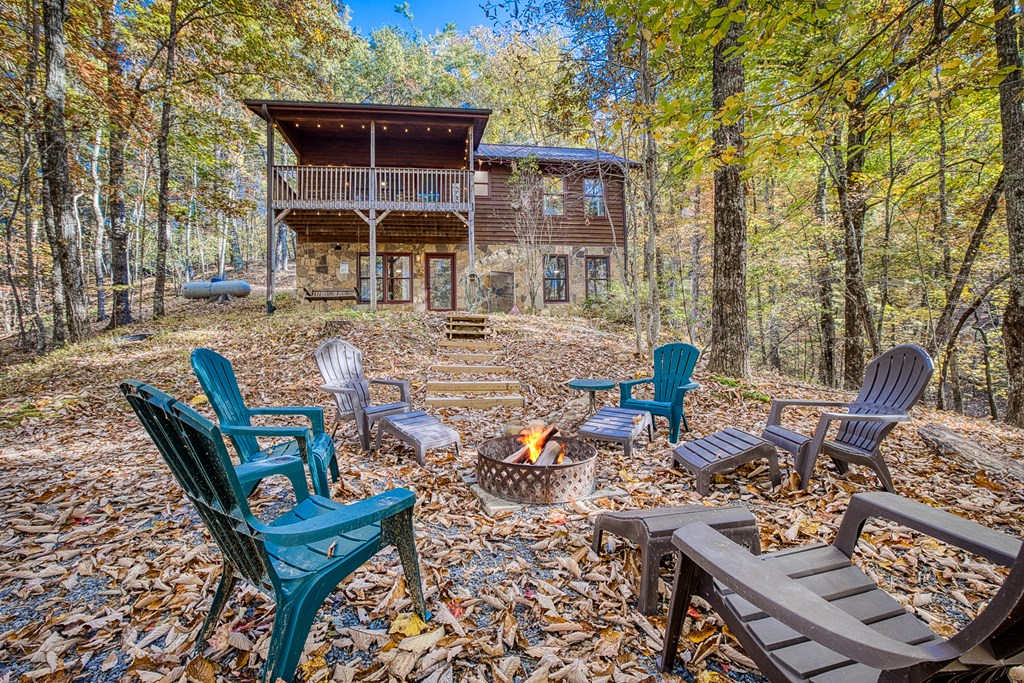 180 Green Ridge Road Blue Ridge, GA 30513 - Photo 27 of 83 a view of a patio with table and chairs and potted plants