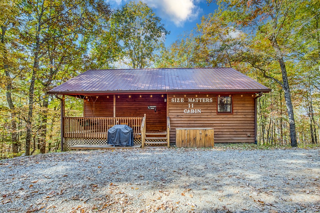 180 Green Ridge Road Blue Ridge, GA 30513 - Photo 29 of 83 a front view of a house with garden