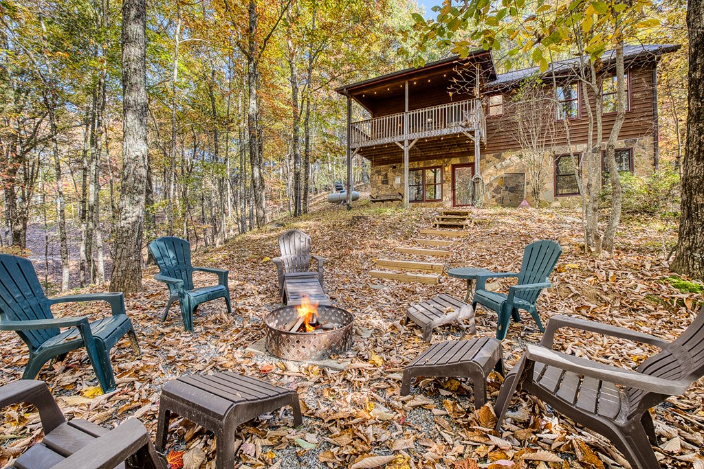 180 Green Ridge Road Blue Ridge, GA 30513 - Photo 3 of 83 a view of a chairs and table in backyard