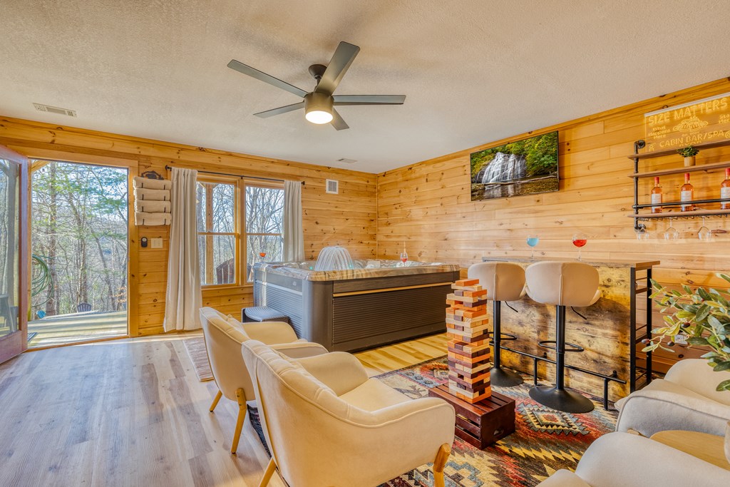 180 Green Ridge Road Blue Ridge, GA 30513 - Photo 51 of 83 a living room with furniture and a floor to ceiling window