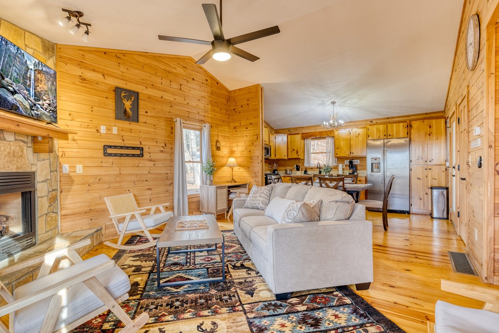 180 Green Ridge Road Blue Ridge, GA 30513 - Photo 7 of 83 a living room with couches and a dining table with kitchen view