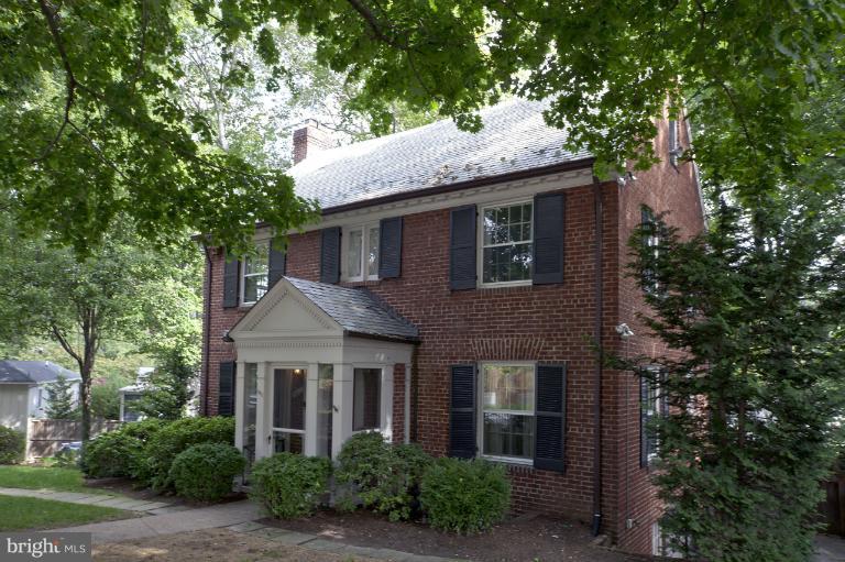 4411 Reno Road Northwest Washington, DC 20008 - Photo 1 of 1 a front view of a house with a garden