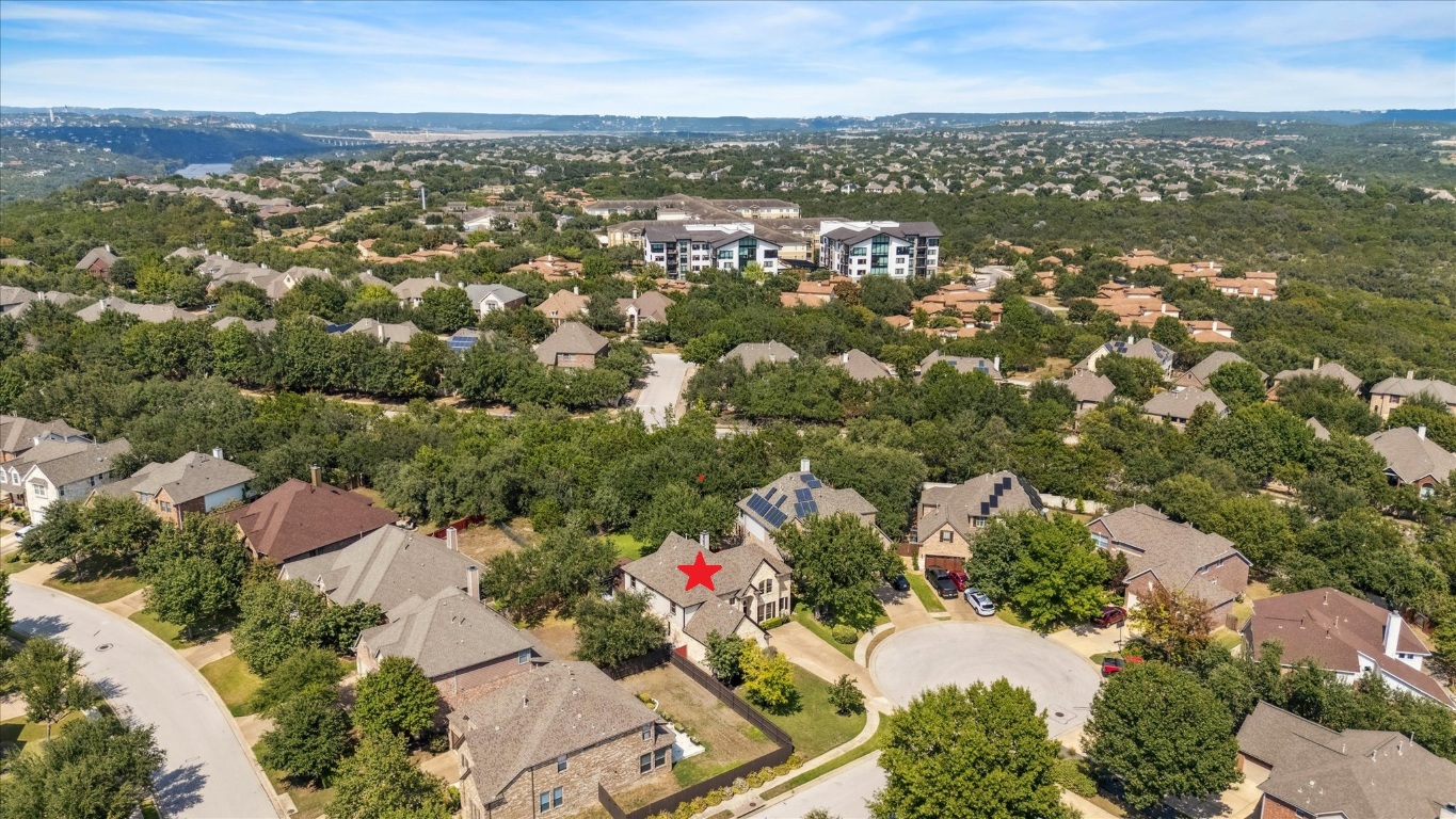 308 Calistoga Court Austin, TX 78732 - Photo 12 of 40 an aerial view of residential building with parking