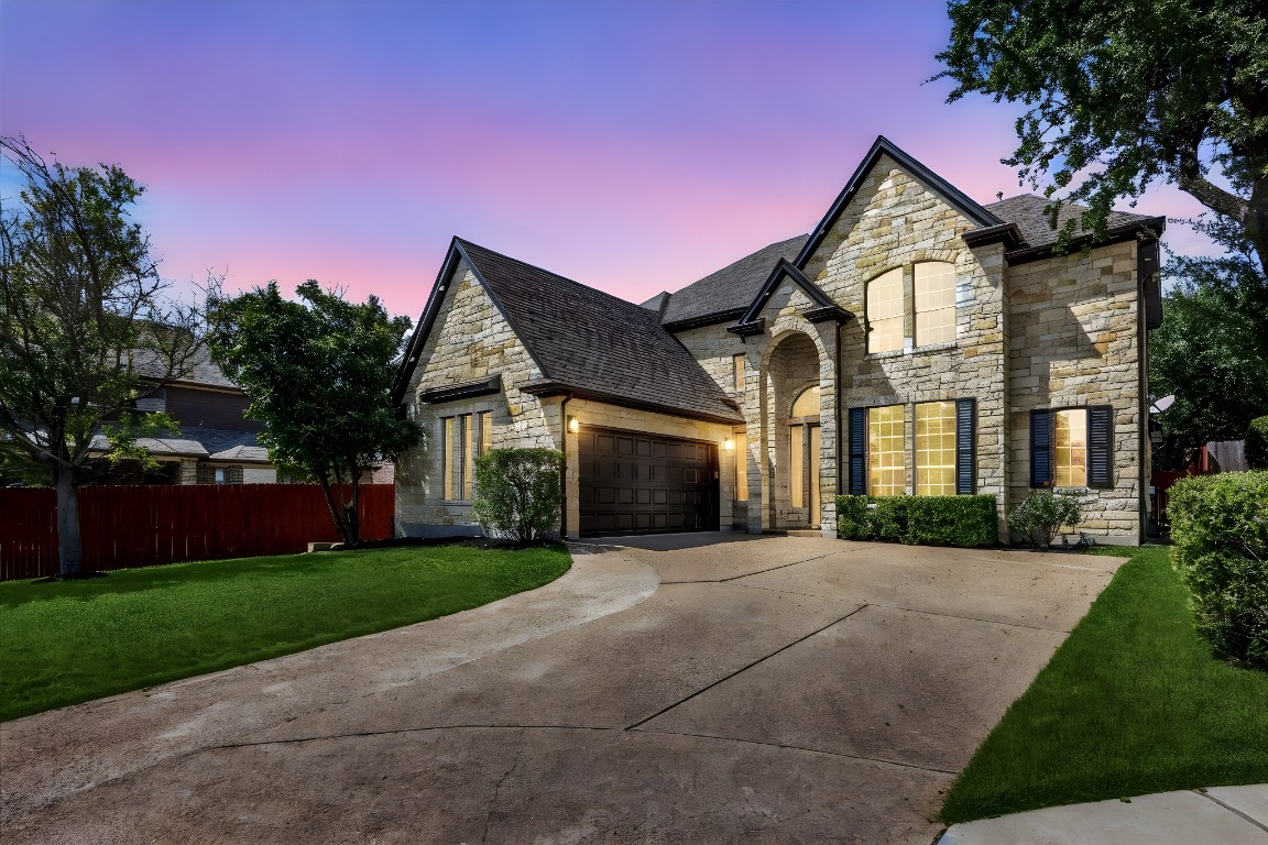 308 Calistoga Court Austin, TX 78732 - Photo 13 of 40 a front view of a house with yard and green space
