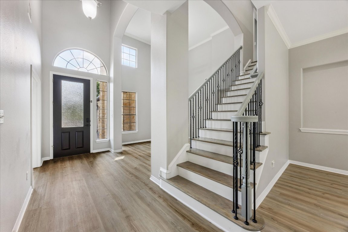 308 Calistoga Court Austin, TX 78732 - Photo 15 of 40 a view of a hallway with wooden floor and entryway