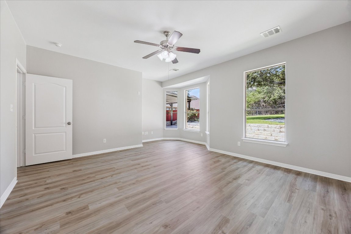 308 Calistoga Court Austin, TX 78732 - Photo 26 of 40 a view of livingroom with hardwood floor and window