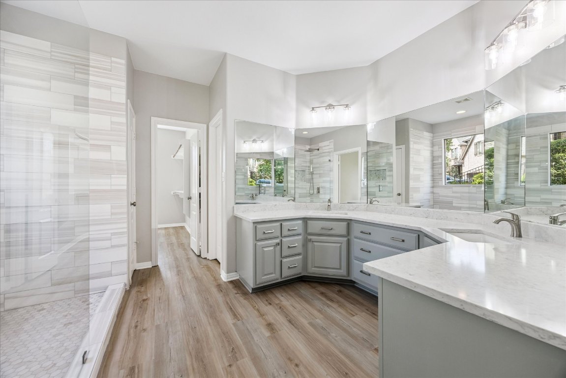 308 Calistoga Court Austin, TX 78732 - Photo 27 of 40 a large kitchen with a sink and cabinets