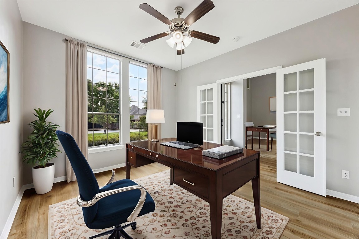 308 Calistoga Court Austin, TX 78732 - Photo 3 of 40 a work room with furniture and a window