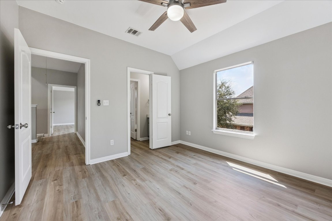 308 Calistoga Court Austin, TX 78732 - Photo 34 of 40 wooden floor in an empty room with a window