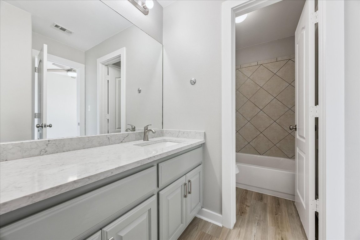 308 Calistoga Court Austin, TX 78732 - Photo 37 of 40 a bathroom with a sink and a mirror