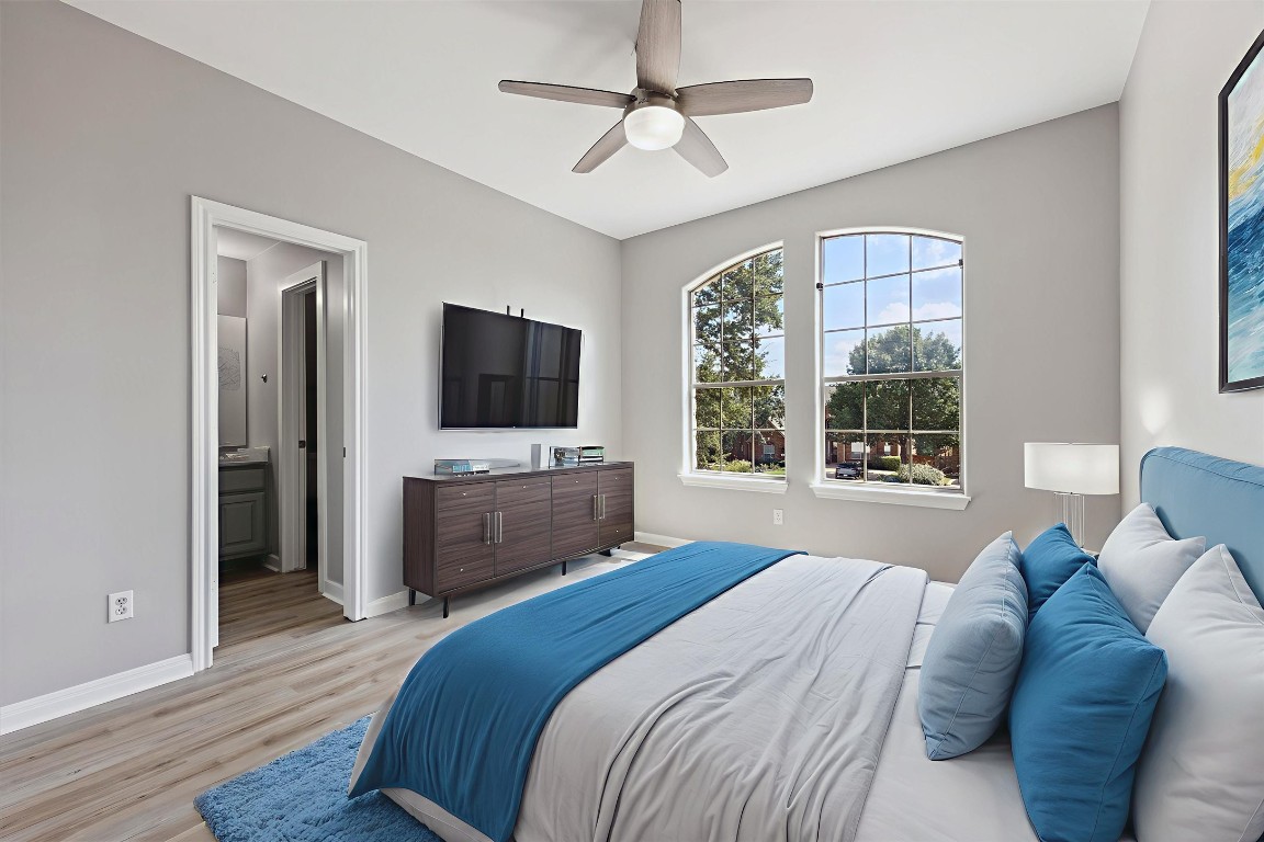308 Calistoga Court Austin, TX 78732 - Photo 9 of 40 a bedroom with a bed flat screen tv and a window