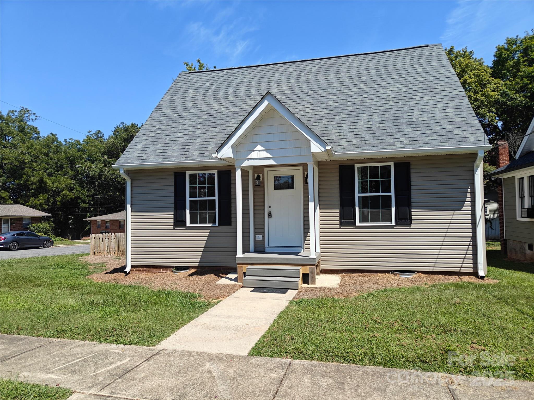 406 4th Street Spencer, NC 28159 - Photo 14 of 16 front view of house with a yard