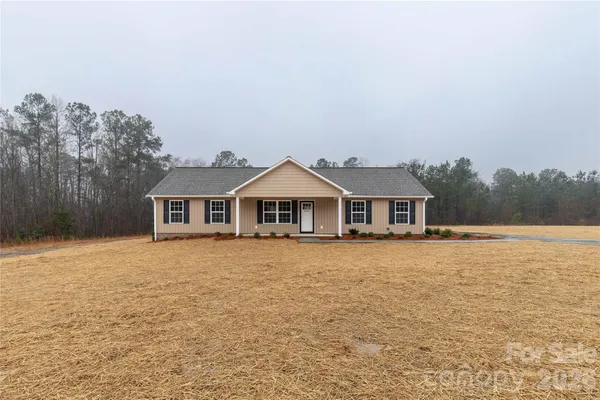 a front view of a house with yard
