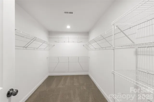 a view of a room with racks on the wall