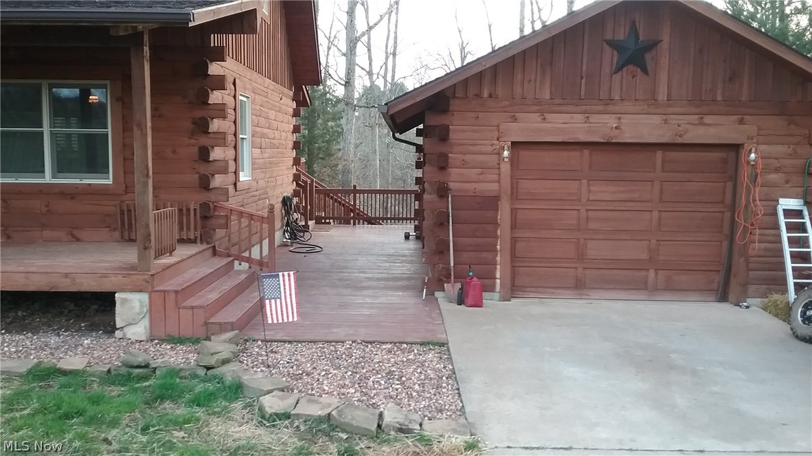 125 Oak Cv Trail Ripley, WV 25271 - Photo 7 of 21 View of the patio area between the cabin and the garage.