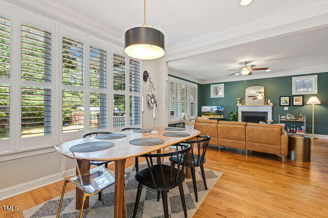 3012 Shenandoah Avenue Durham, NC 27704 - Photo 15 of 50 a view of a dining room with furniture window and wooden floor