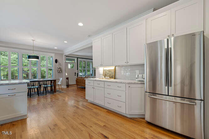 3012 Shenandoah Avenue Durham, NC 27704 - Photo 24 of 50 a kitchen with stainless steel appliances a refrigerator sink and cabinets