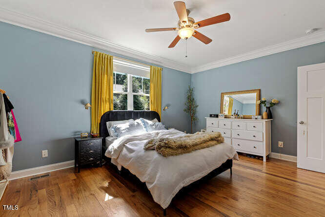 3012 Shenandoah Avenue Durham, NC 27704 - Photo 26 of 50 a bedroom with a bed and a chandelier