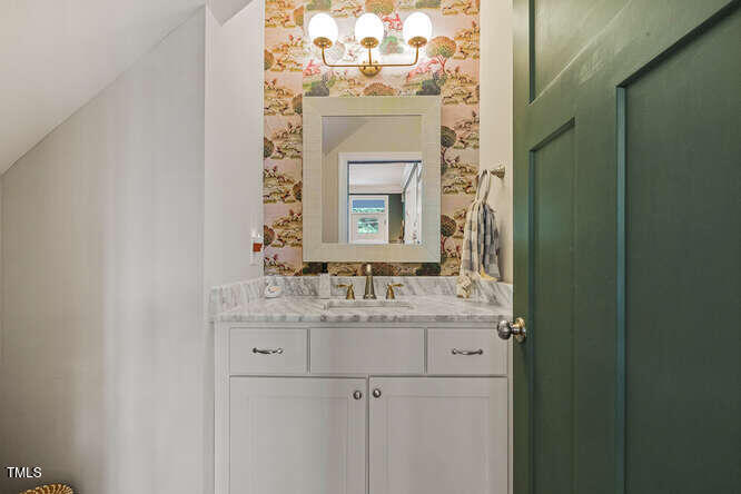 3012 Shenandoah Avenue Durham, NC 27704 - Photo 30 of 50 a bathroom with a sink and a mirror