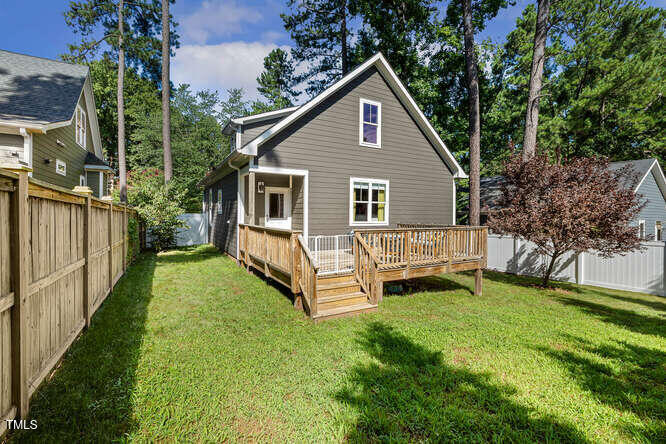 3012 Shenandoah Avenue Durham, NC 27704 - Photo 39 of 50 a view of a house with a yard and deck