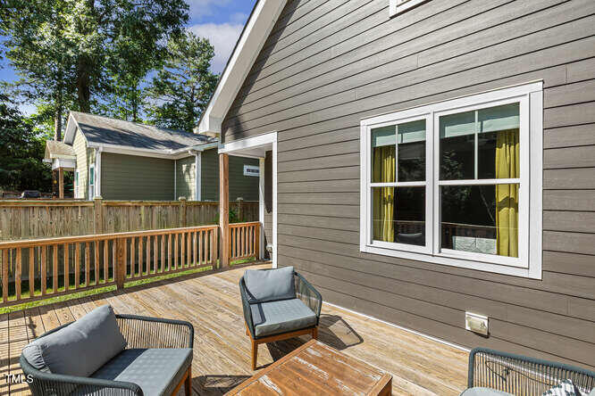 3012 Shenandoah Avenue Durham, NC 27704 - Photo 40 of 50 a view of a chair and table in the back yard of the house