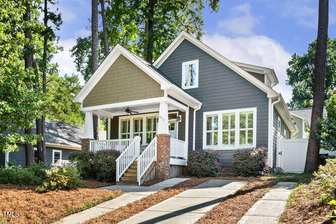 3012 Shenandoah Avenue Durham, NC 27704 - Photo 3 of 50 a front view of a house with a yard and potted plants