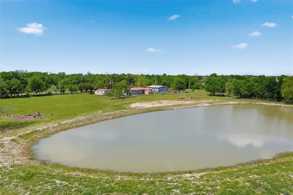a view of a lake and a yard
