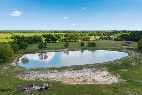 a view of a lake with a big yard